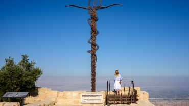 Serpentine Cross at the top of Mount Nebo in Jordan, place where Moses viewed the Holy Land