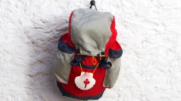 Pilgrim scallop and backpack on Way of St James