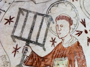 The deacon St. Lawrence holding a gridiron, reminding of his martyrdom. Gothic fresco in Linderod church, Sweden