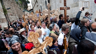 Orthodox Christian pilgrims commemorate the path Jesus carried his cross on the day of his crucifixion along the Via Dolorosa in Jerusalem on Good Friday