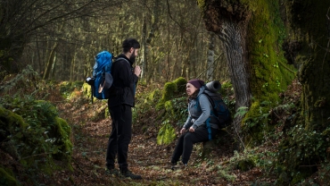 A couple of pilgrims rest from the fatigue of walking the Camino de Santiago.