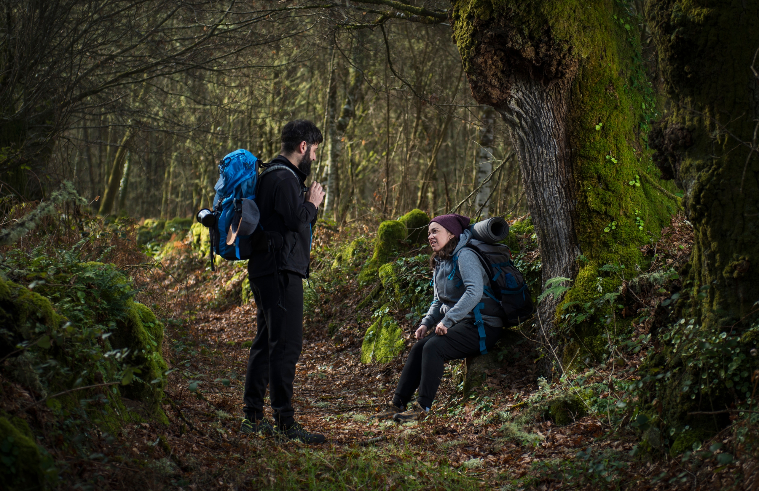 A couple of pilgrims rest from the fatigue of walking the Camino de Santiago.