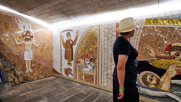 Spain. Woman looking the Crypt guards the tomb of Santo Domingo de la Calzada