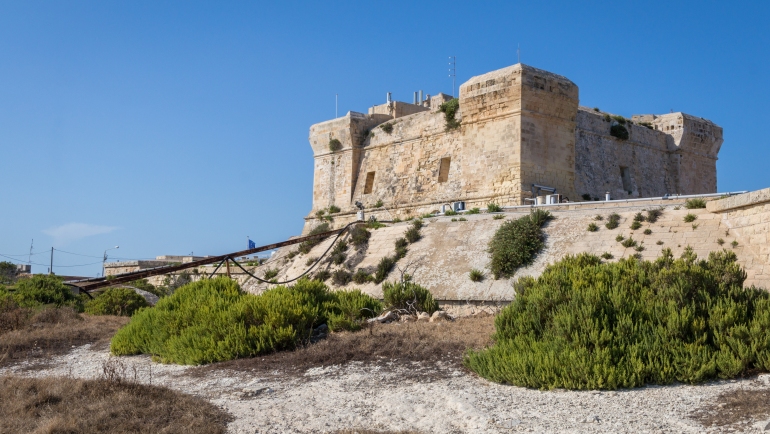 St. Lucians Tower or It-Torri ta' San Lucjan in Maltese, a large fortified Knights of St John watchtower overlooking Marsaxlokk Bay