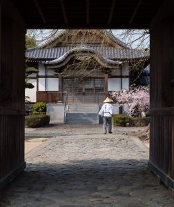 Tokushima, Japan - April 2, 2018: Walking pilgrim at the entrance to Jizoji, temple number 5 on Shikoku pilgrimage
