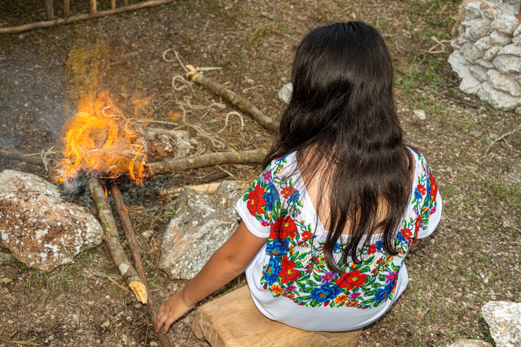 Mayan woman preparing a bonfire for the pixal hanal celebration, Yucatán, Mexico