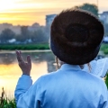 Ultra-Orthodox Jewish Hasids pilgrims pray on a bank of a lake near the tomb of Rabbi Nachman of Breslov during the celebration of Rosh Hashanah, the Jewish New Year, in Uman, Ukraine, September 2016