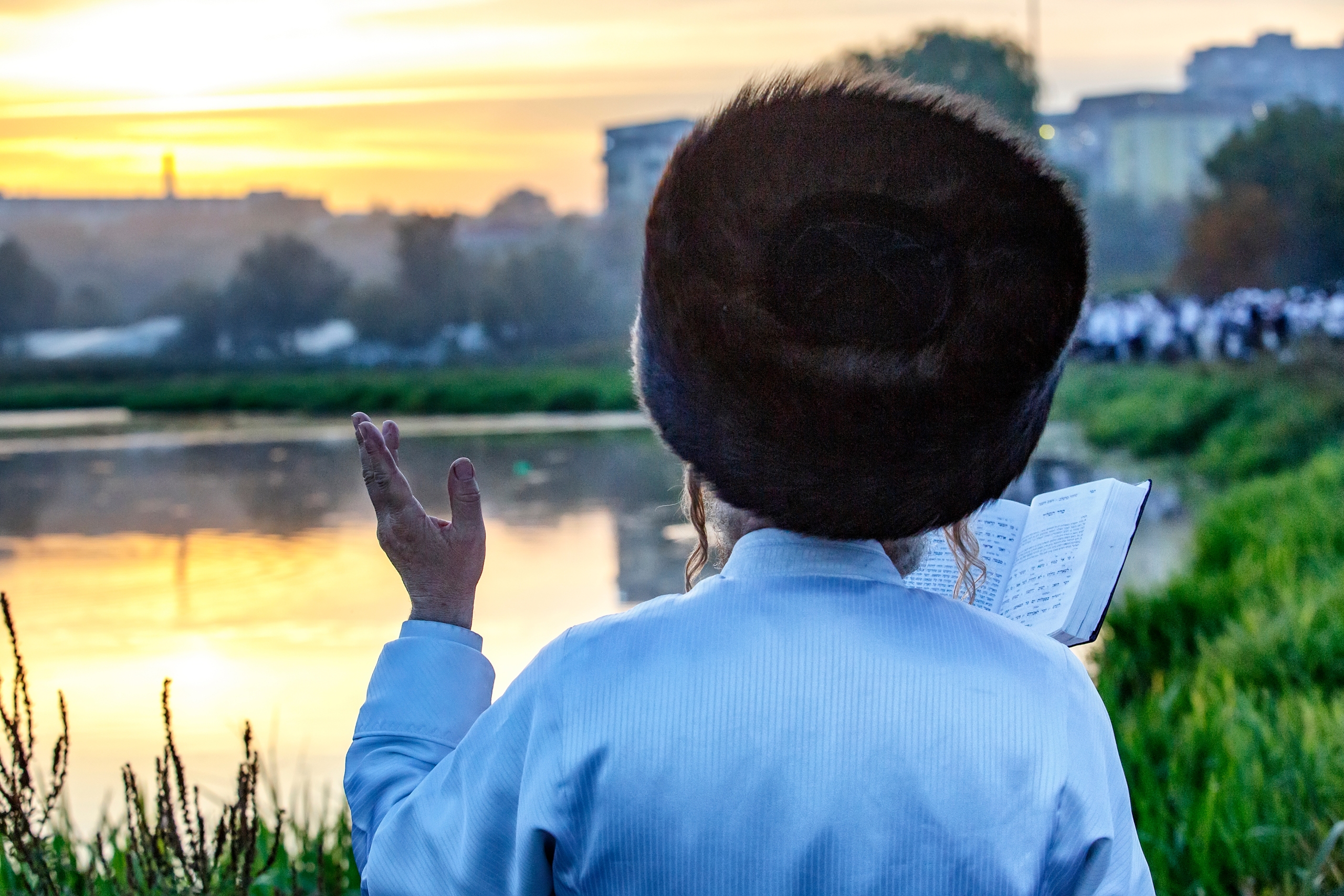Ultra-Orthodox Jewish Hasids pilgrims pray on a bank of a lake near the tomb of Rabbi Nachman of Breslov during the celebration of Rosh Hashanah, the Jewish New Year, in Uman, Ukraine, September 2016