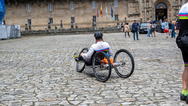 Pilgrim with a disability arriving in Santiago de Compostela.
