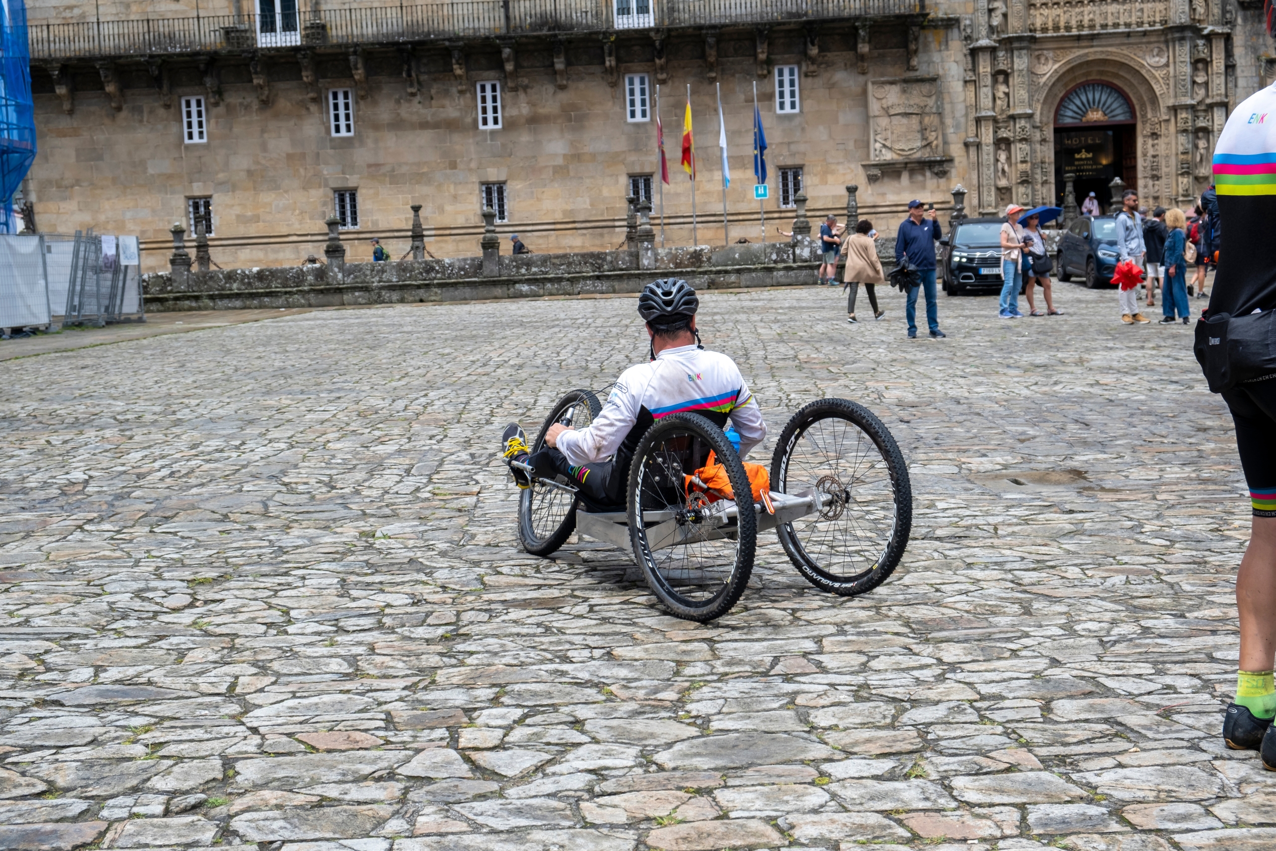 Pilgrim with a disability arriving in Santiago de Compostela.