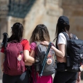 Pilgrims on the Camino de Santiago arrive at the Plaza del Obradoiro
