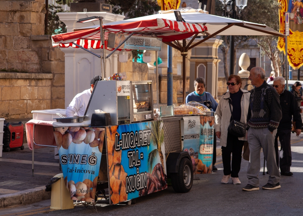 Street stall selling mqaret during the St. Joseph's Day festivities in Rabat, Malta