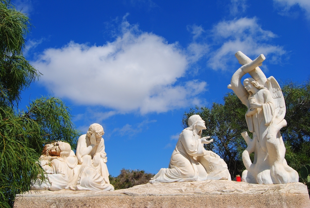 Marble statues marking the Stations of the Cross punctuate the track leading to the top of the hill of Ta'Ghammar