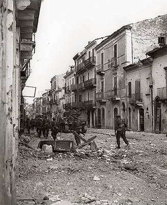 Infantry from the Loyal Edmonton Regiment and Sherman tanks from the Three Rivers Regiment during the Battle for Ortona.