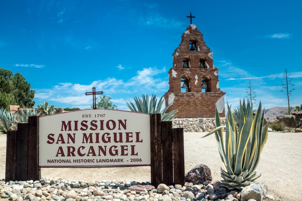 The sign and campanario at Mission San Miguel Arcangel in San Miguel, California along the historic mission trail.