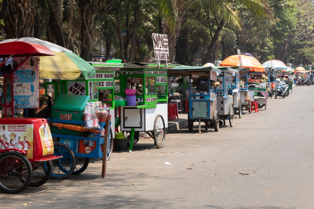 Jakarta, Indonesia - October 20, 2019: Street food stalls, in which sell nasi goreng, mie ayam, bakso... Typical Indonesian food, in the Central Jakarta district. Travel photography.