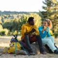 Pilgrim couple eat while resting on the road