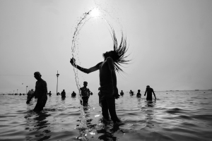 Hindu devotees take the holy bath at Gangasagar Mela