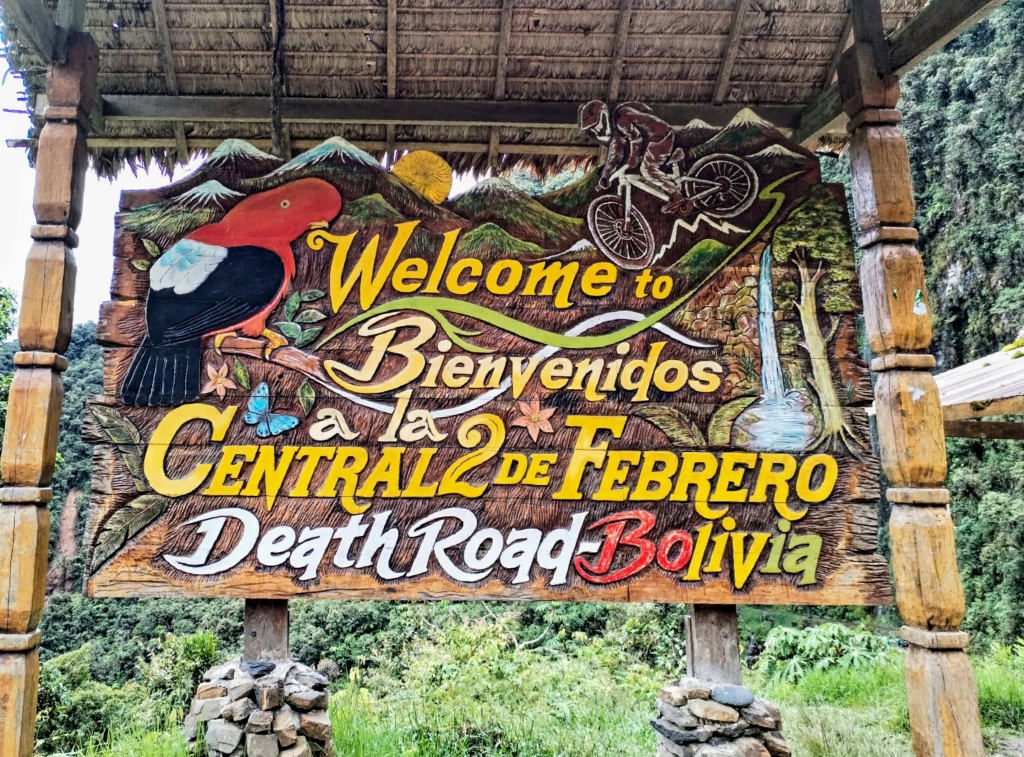 A group of cyclists rides along the "most dangerous road in the world," a steep mountain road that connects the city of La Paz with the Bolivian jungle.