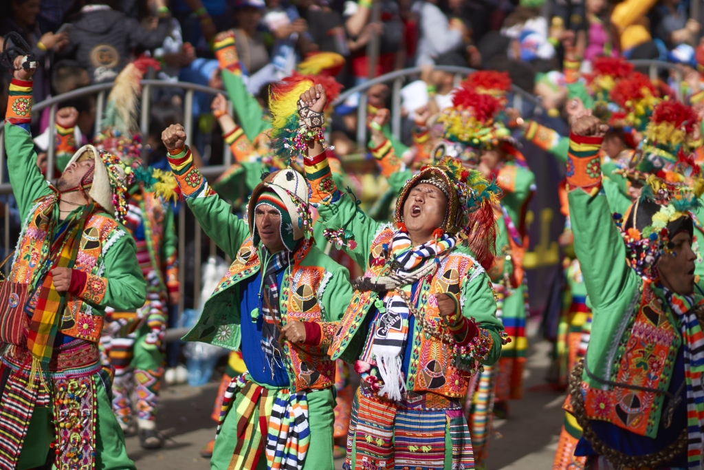 Tinkus dancers in colourful costumes performing at the annual Oruro Carnival