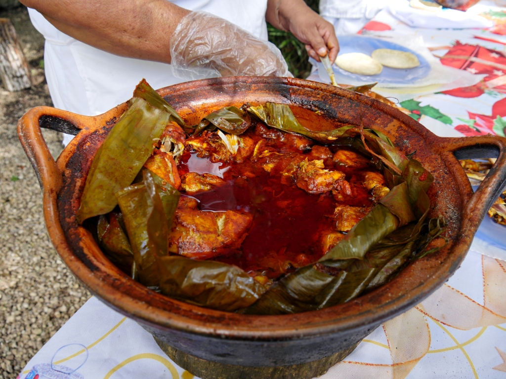 A pot of chicken cooked for hours in an underground traditional oven in a village in Costa Maya, Mexico.