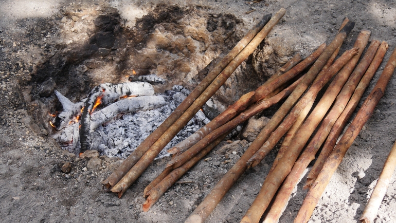Pieces of wood for kindling in a traditional underground oven in a village