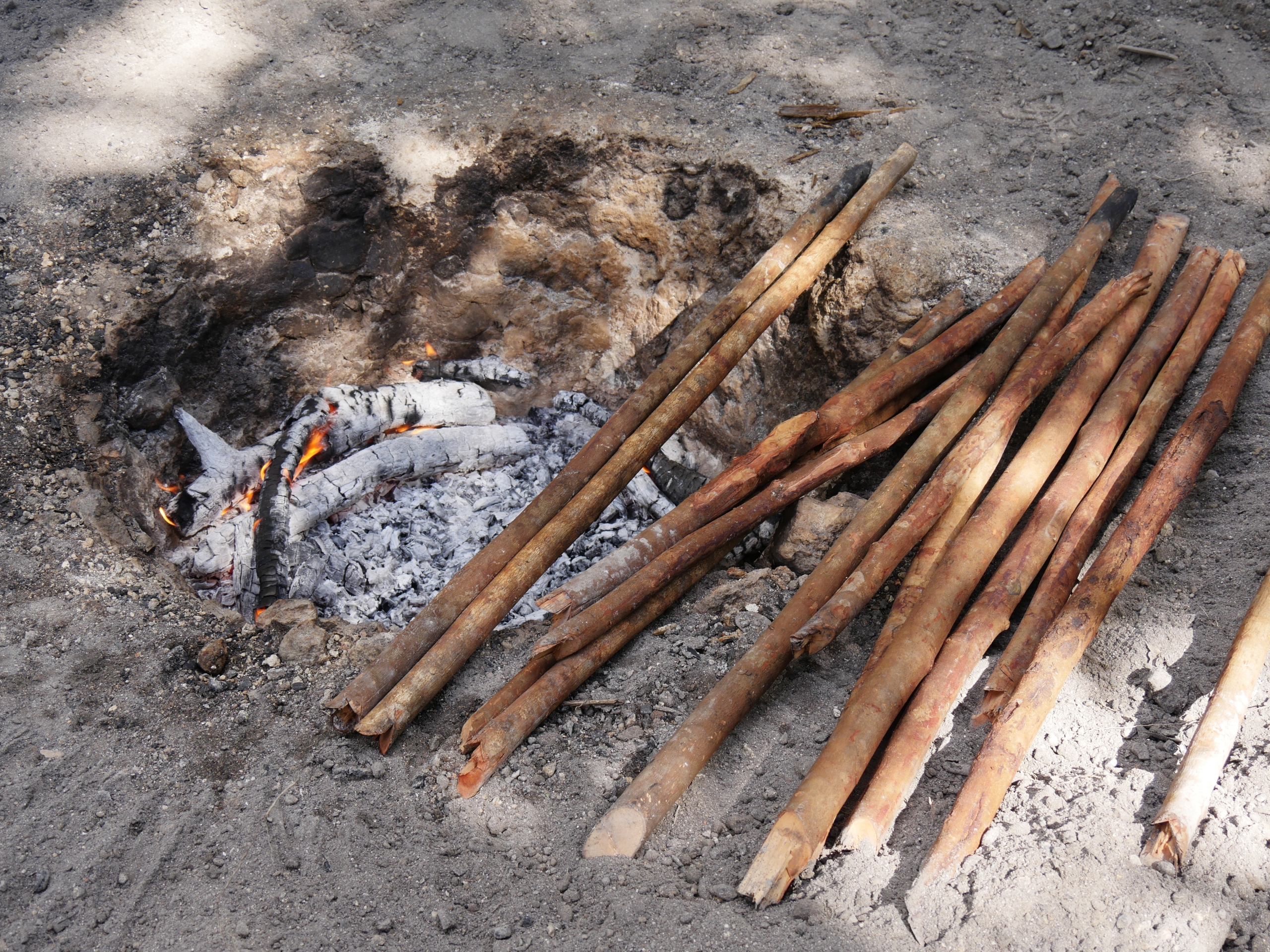 Pieces of wood for kindling in a traditional underground oven in a village