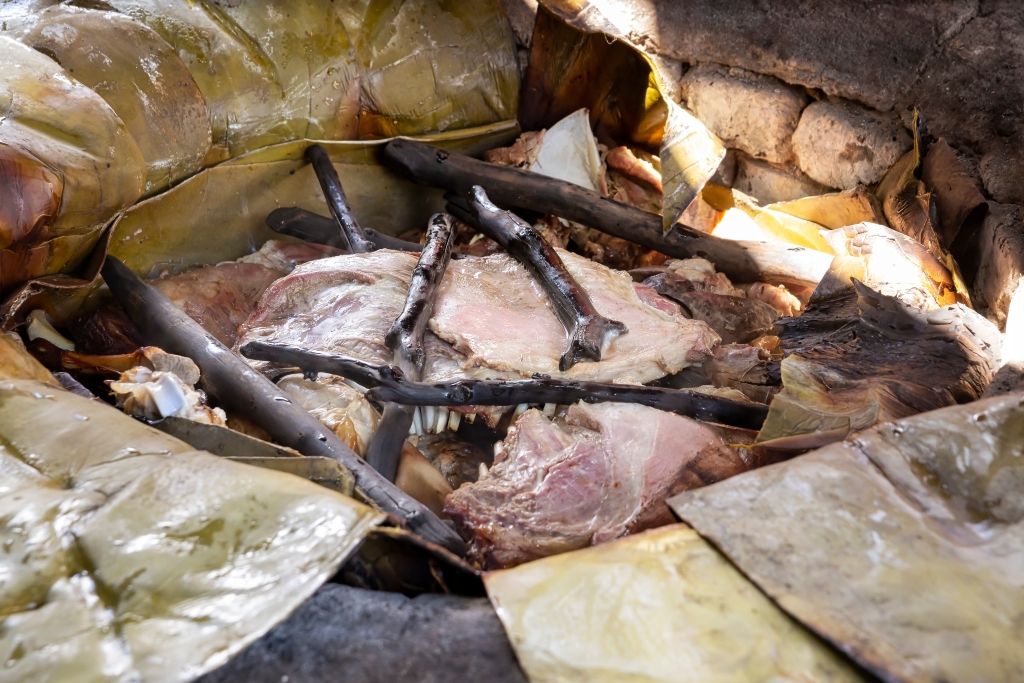 Cochinita pibil freshly cooked in a píib