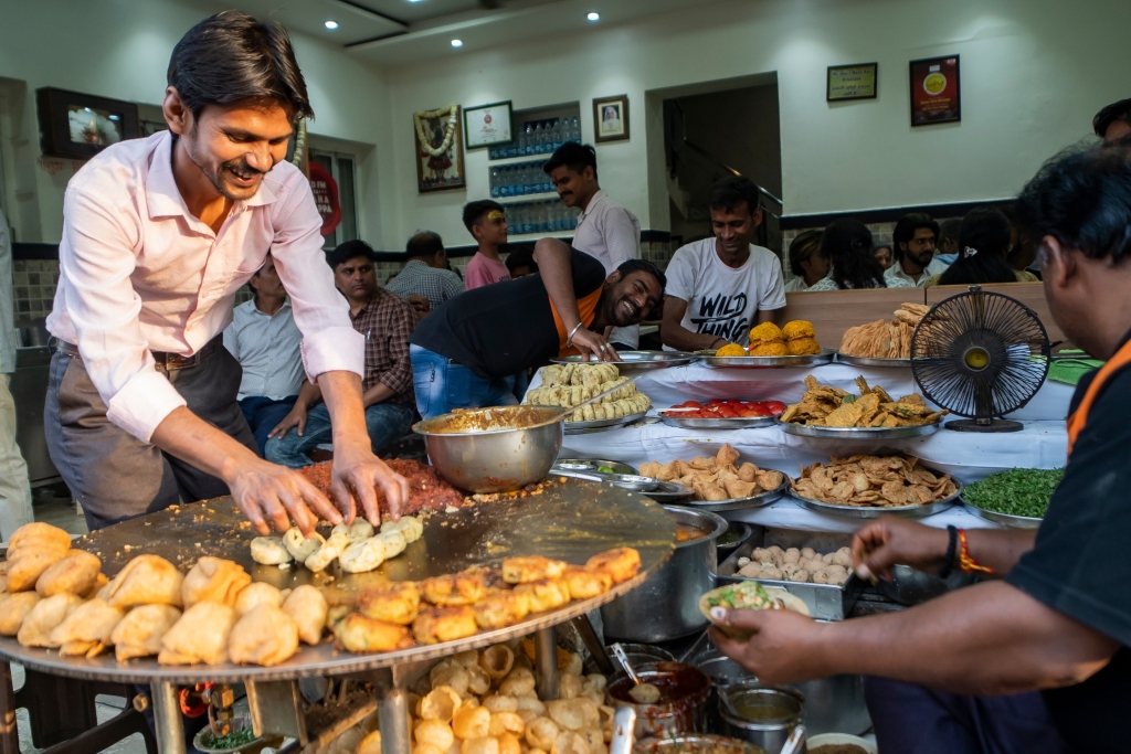 Food shop selling and preparing chaat in Varanasi, India