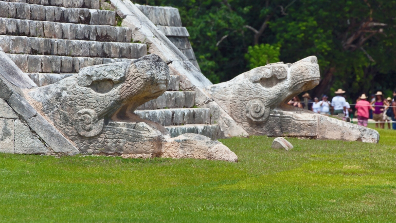 The sculpture at the base of the feathered serpent pyramid - Chichen Itza, Mexico