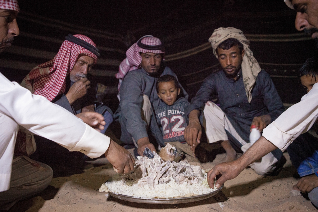 Jordanian Bedouins eating Mansaf in Wadi Rum