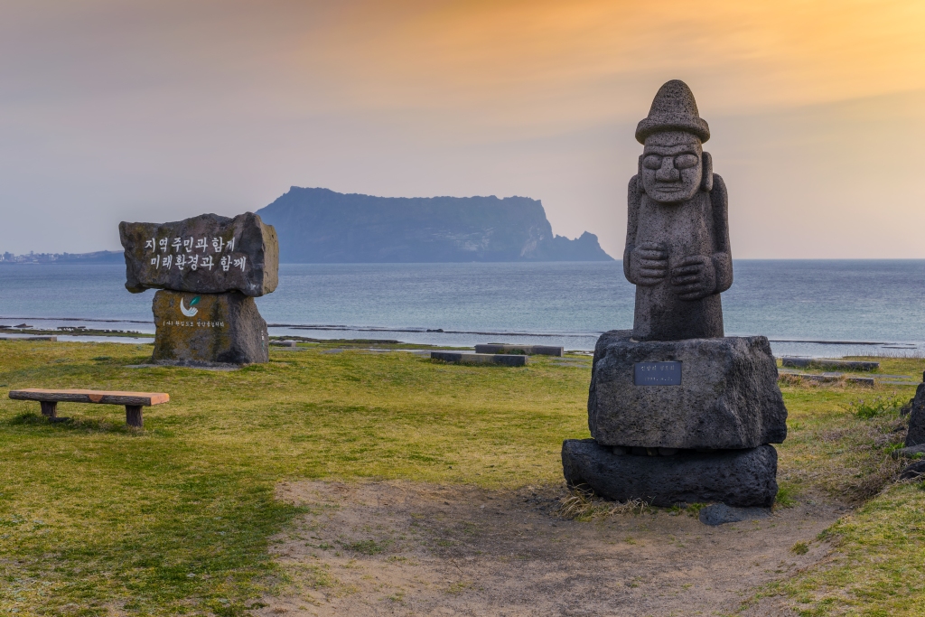 Statue of Dol Hareubang and Jeju do Seongsan Ilchulbong, Jeju Island, South Korea