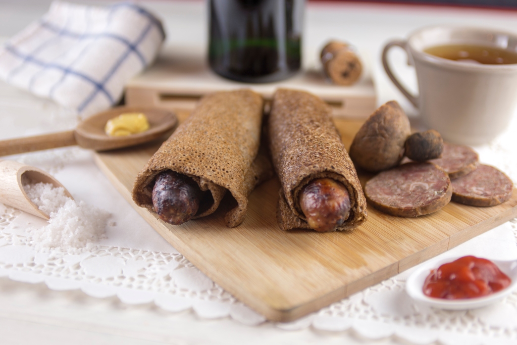 Sausage galette. Traditional Breton speciality sausage pancake, with cheese, andouille 