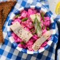 Traditional Swedish salad with herring, apple and beetroot