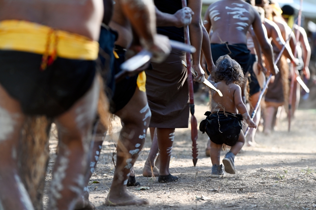 Australian Indigenous people marching at the Laura Quinkan Dance Festival, Cape York, Queensland, Australia.