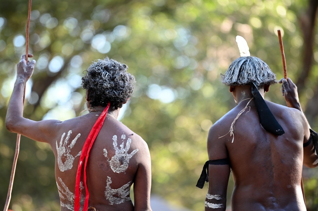 Australian Aboriginal people carrying traditional weapons during a ceremonial dance in Cape York, Australia