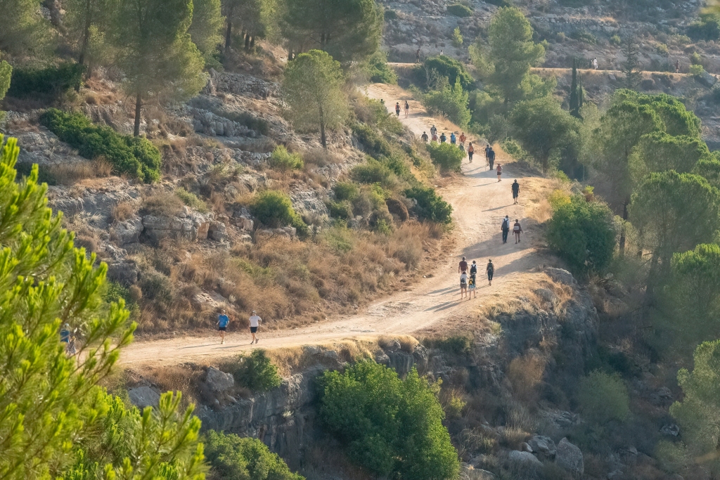 Pilgrims walk in the Judean mountains on the Way to Jerusalem