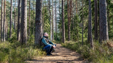 A man experiencing silence in nature