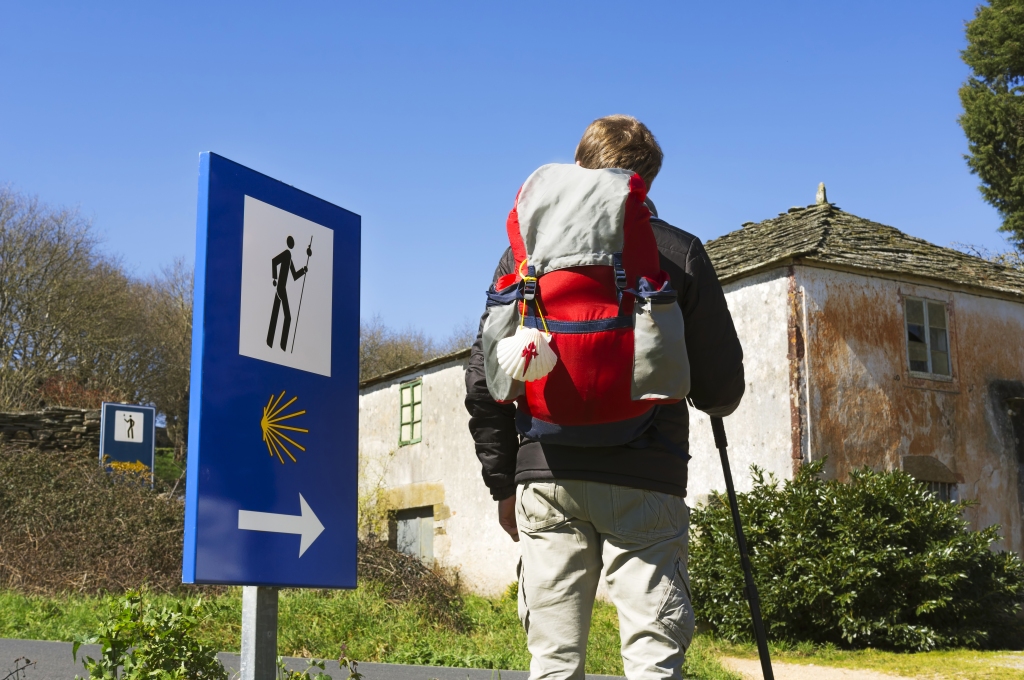 Pilgrim in Palas de Rei. The Camino de Santiago helps the development of rural communities.
