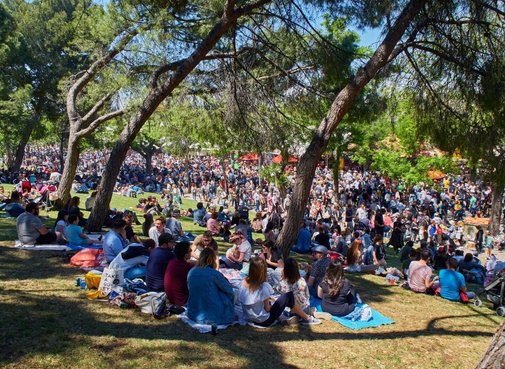 Citizens honoring its patron, Saint Isidro Labrador, at San Isidro festivity fair, in Pradera de San Isidro park of Madrid.