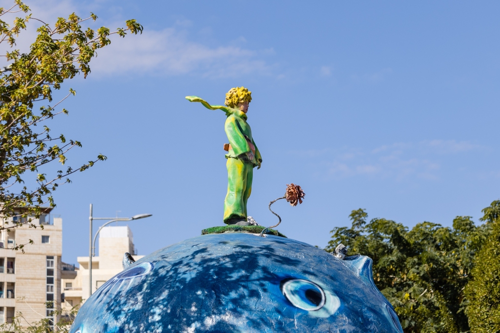 Monument in Eilat (Israel) to the Little Prince and his red rose standing on a blue asteroid