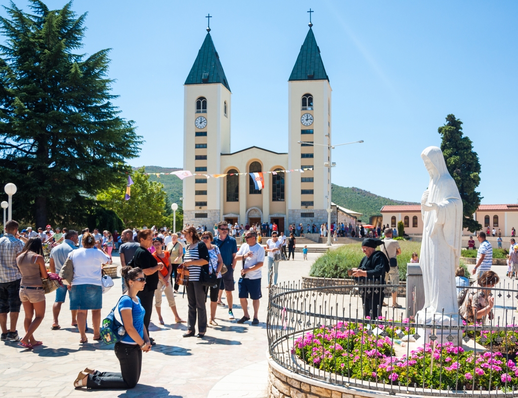 Pilgrims in front of the parish of St. James the Apostle in Medjugorje