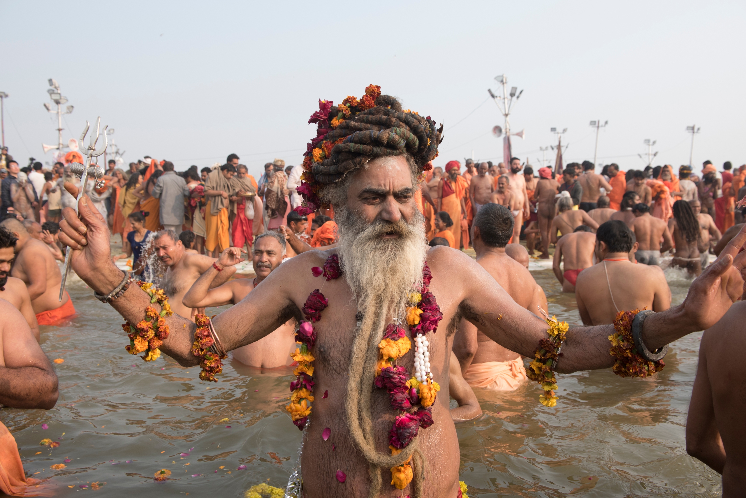 Hindu holy men and pilgrims takes a dip during the Shahi Snan (grand bath) at kumbh mela in Allahabad Uttar Pradesh India