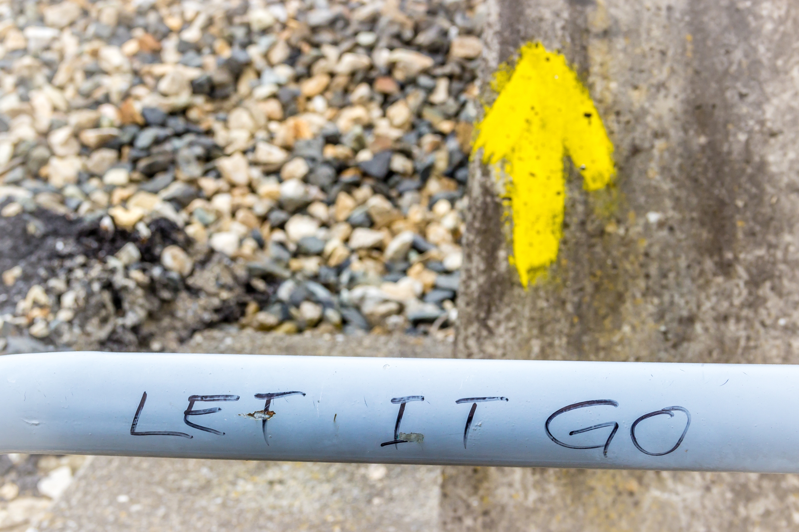 Spiritual Enlightning Motivational Writing next to the Yellow Arrow the Symbol of the Way of St James