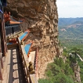 Taoist temple carved in rock with large vistas of space below in Henshan Bei