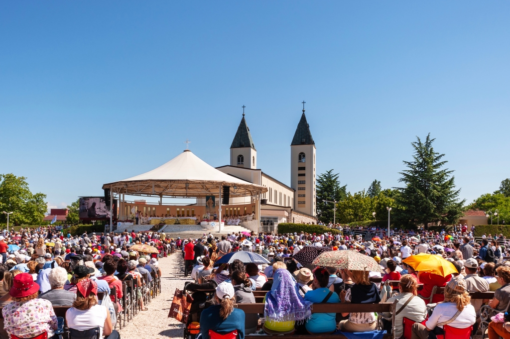 Pilgrims gather during the 30th anniversary of the apparition