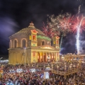 Fireworks at the Mosta festival at night with the famous Mosta Dome and the People of Malta are celebrating the Feast of the Assumption of 'Santa Maria'.