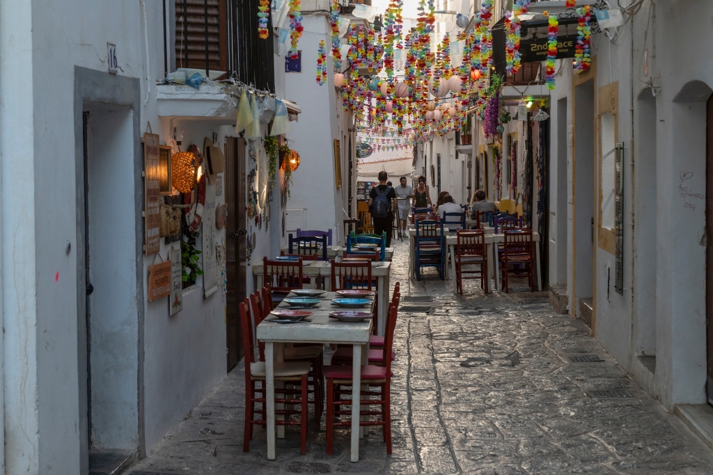 A simple, small, and cozy restaurant with décor, located on a narrow street in Ibiza town center.